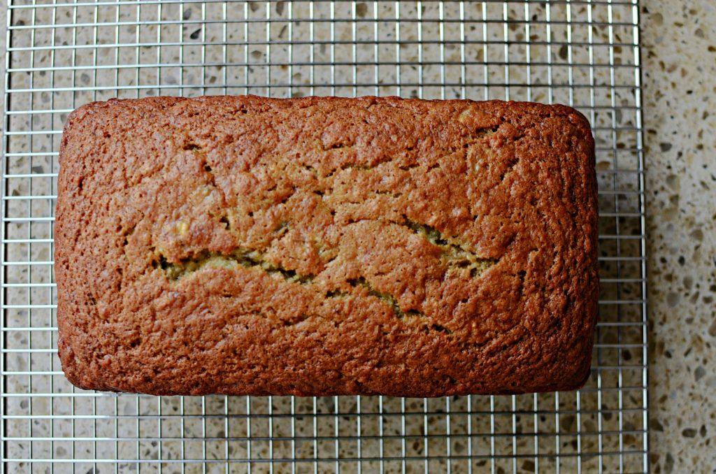 Banana bread loaf on cooling rack