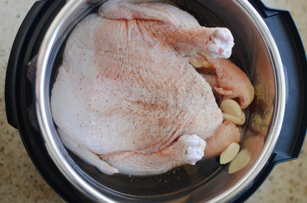 Whole chicken in instant pot with garlic cloves