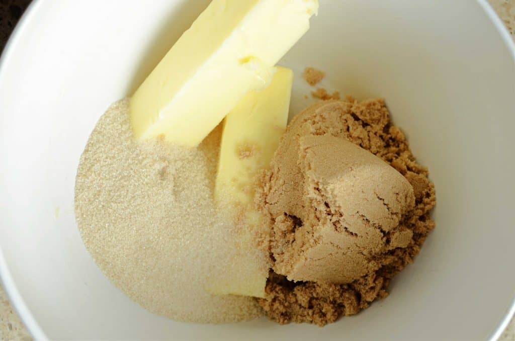 Brown sugar, sugar, and butter in white mixing bowl