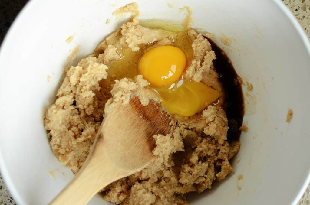 Eggs and vanilla extract added to cookie bar dough