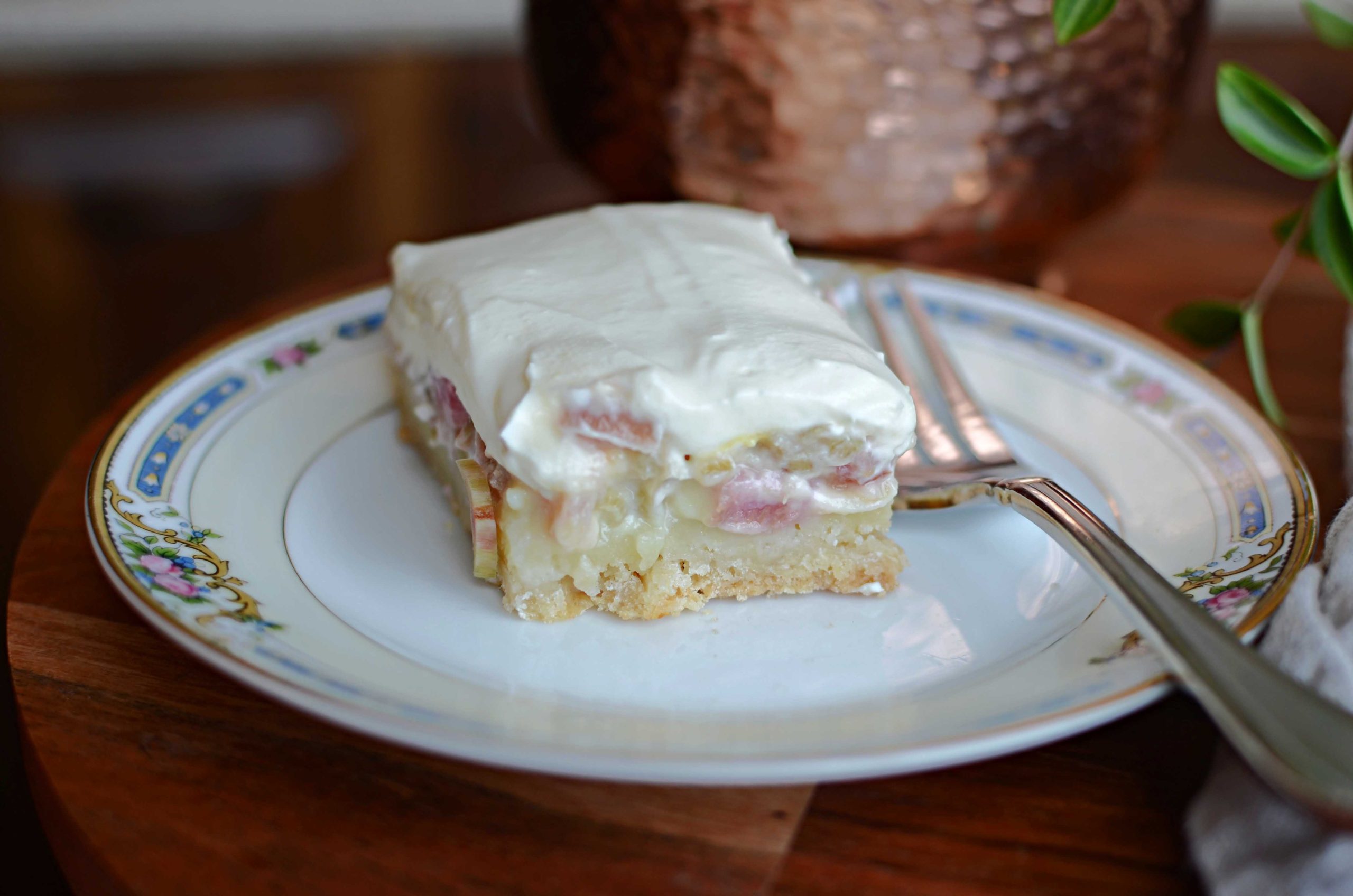 Rhubarb custard bar on plate with fork