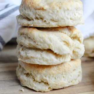 Three buttermilk biscuits stacked on top of one another