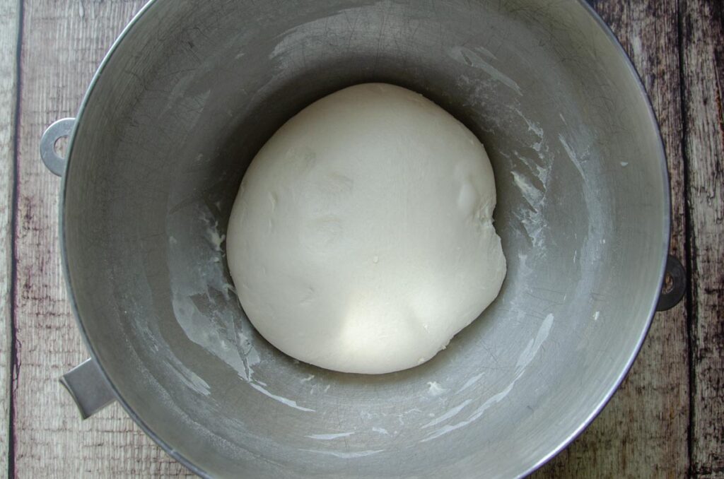 sourdough English muffin dough in metal bowl