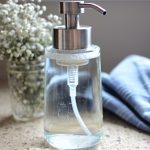 hand soap dispense with flowers and hand towel