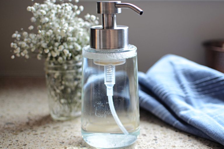 hand soap dispense with flowers and hand towel