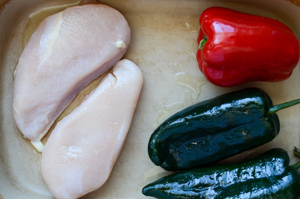 raw chicken breasts, red pepper and 2 poblano peppers 