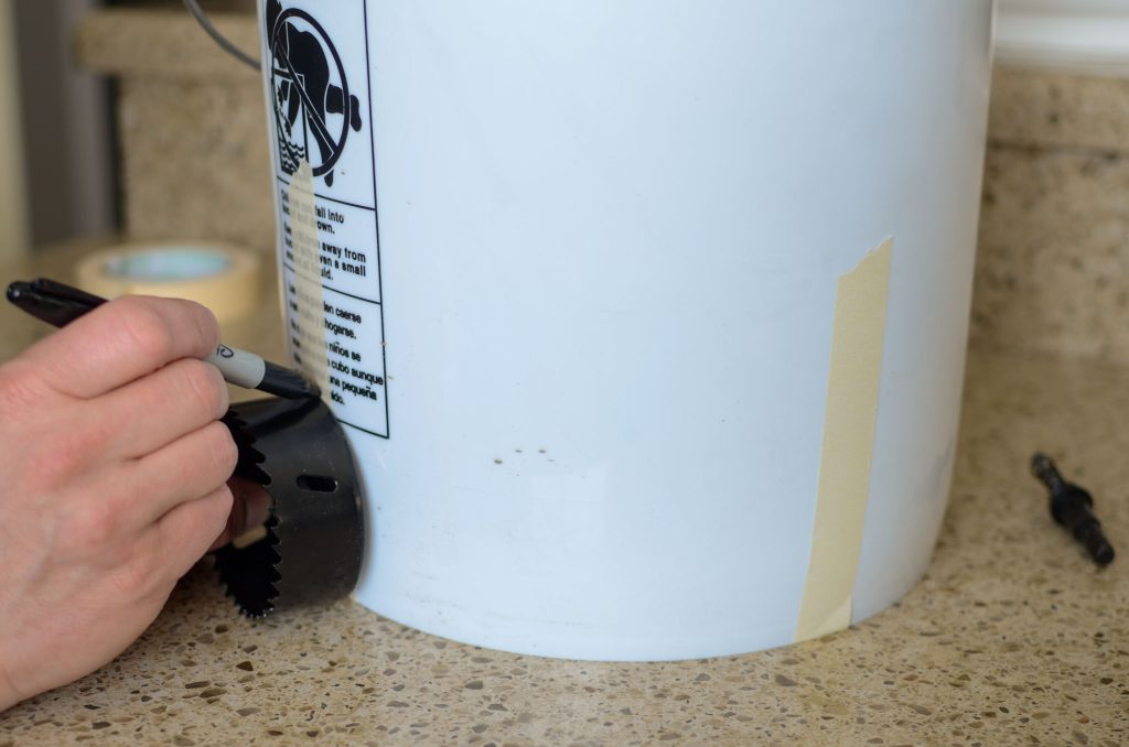 marking on the side of a 5 gallon bucket with sharpie