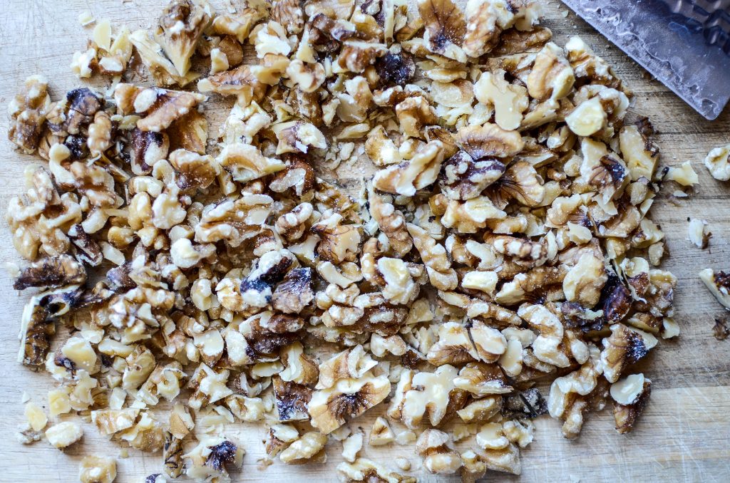 chopped walnuts on cutting board