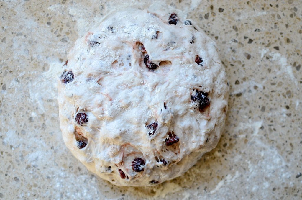 shaped dough on floured counter