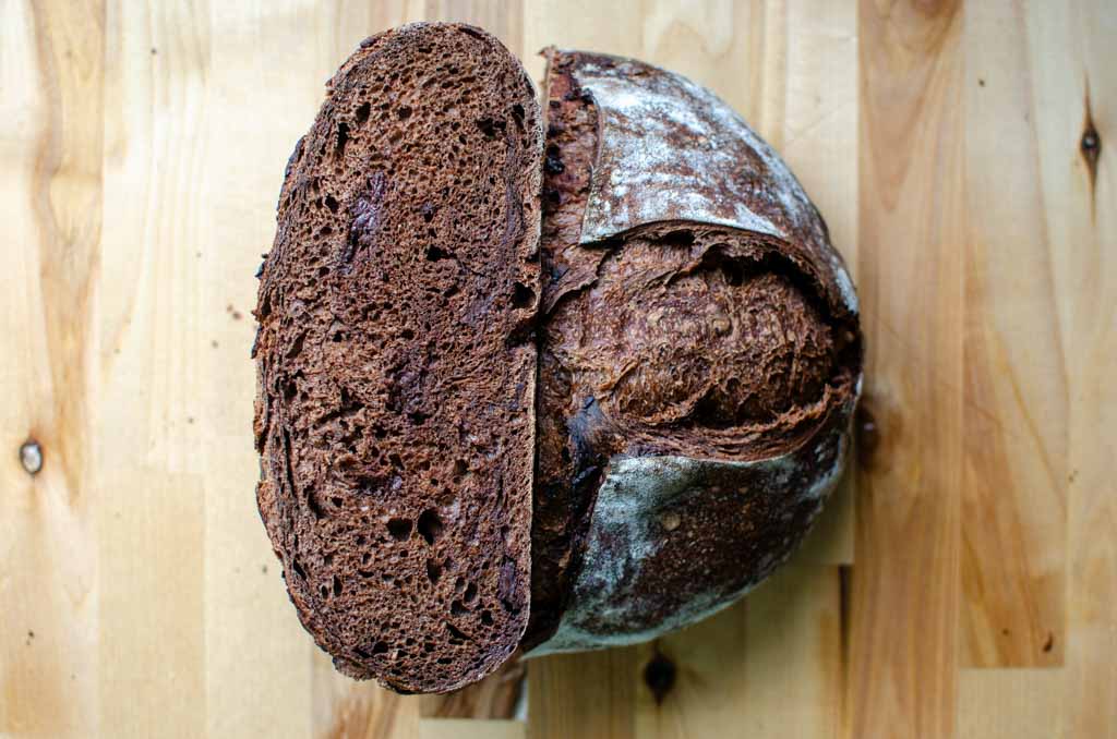 double chocolate sourdough bread loaf cut in half