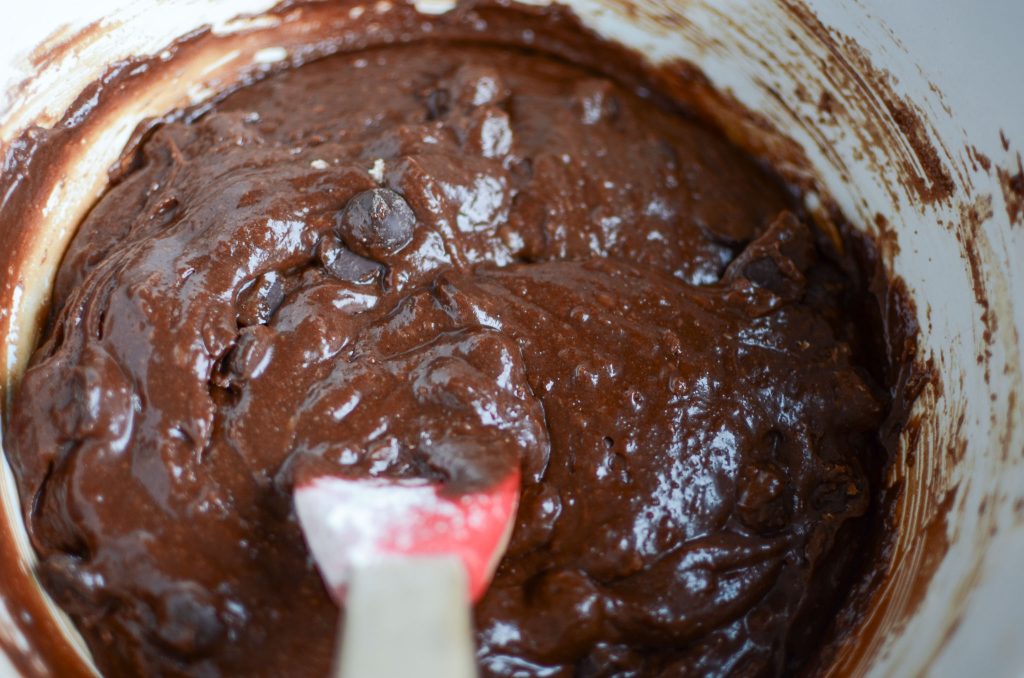 One-Bowl Fudgy Sourdough Brownies dough in white bowl with rubber spatula