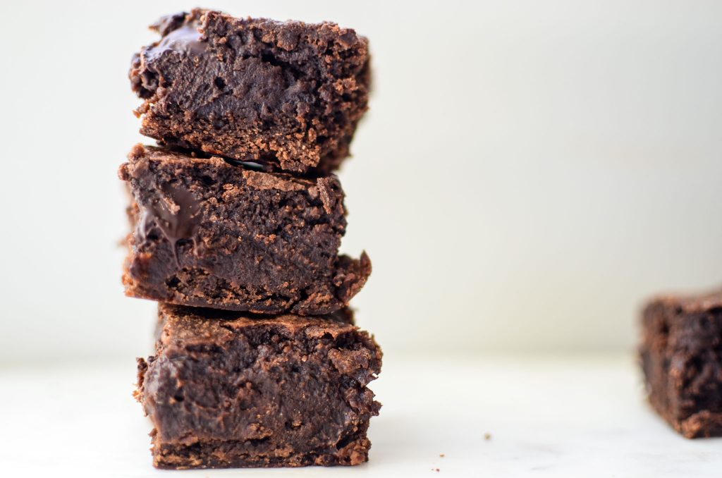 One-Bowl Fudgy Sourdough Brownies stacked on top of one another