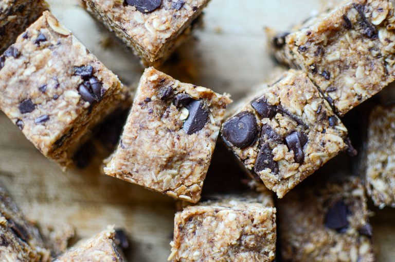 Bite-size heavenly hunk copycat bars on wooden cutting board