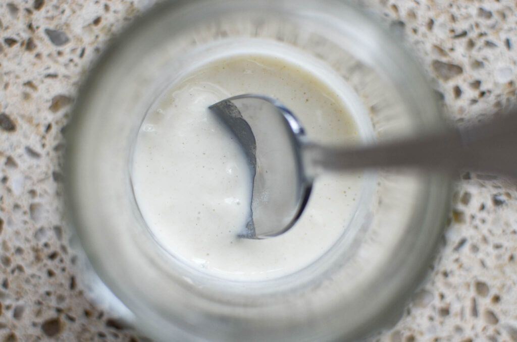 Discard that was revived from frozen in glass jar with spoon