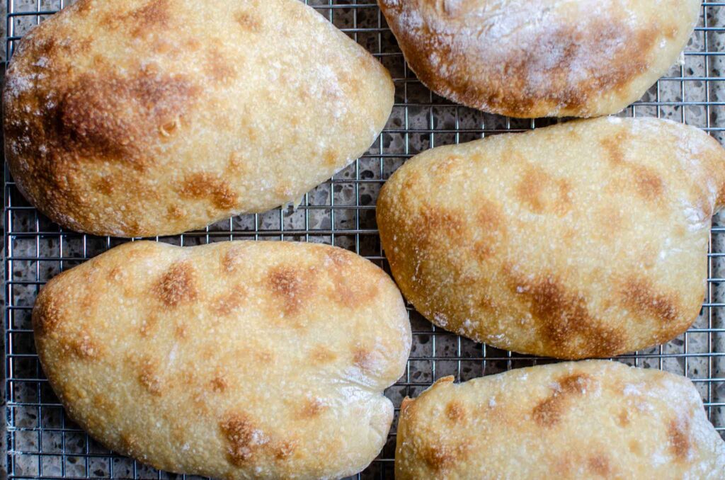 sourdough ciabatta rolls on wire rack