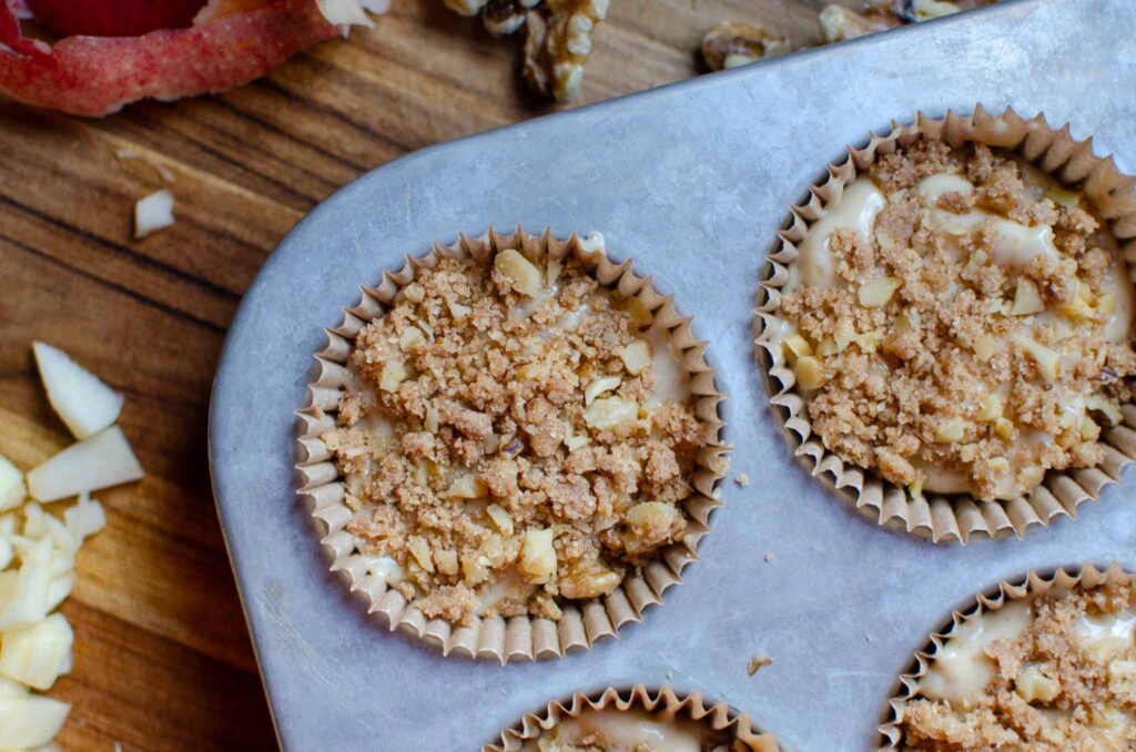 discard apple walnut bread loaf muffins in lined muffin tin