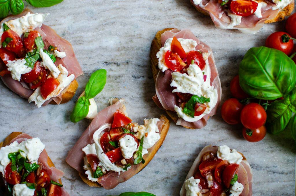 Easy Burrata Bruschetta and Prosciutto Toast on marble board