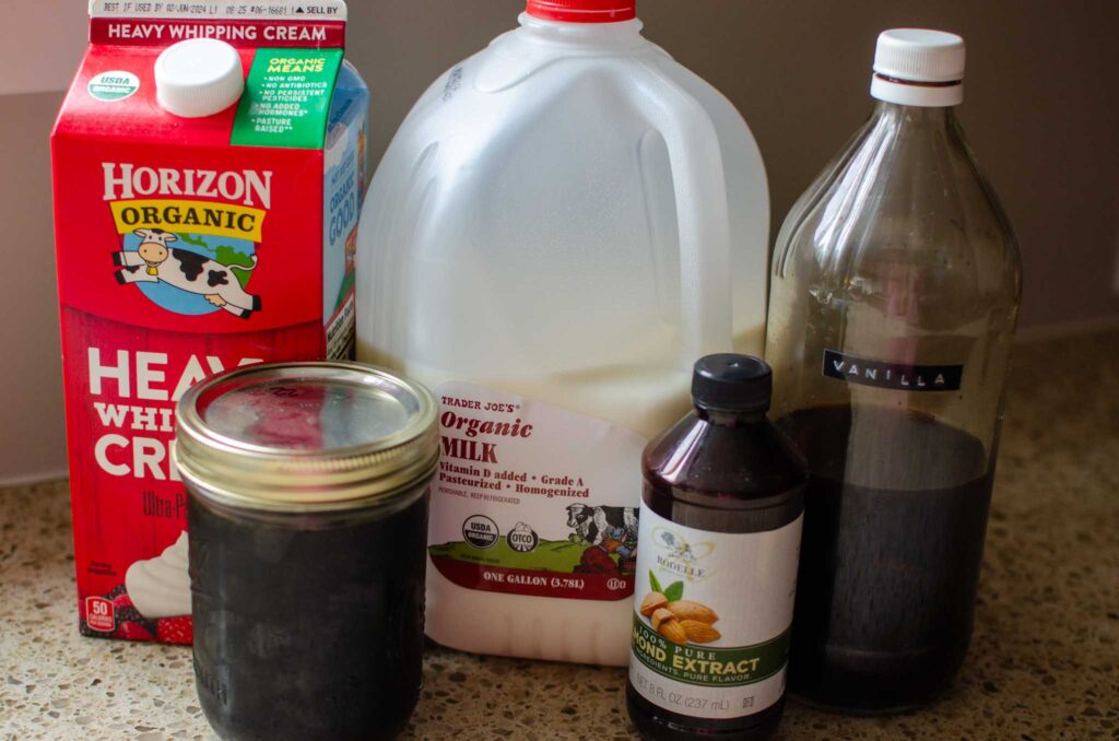 Ingredients for Homemade Italian Sweet Cream Coffee Creamer: heavy whipping cream, whole milk, vanilla extract, almond extract and maple syrup