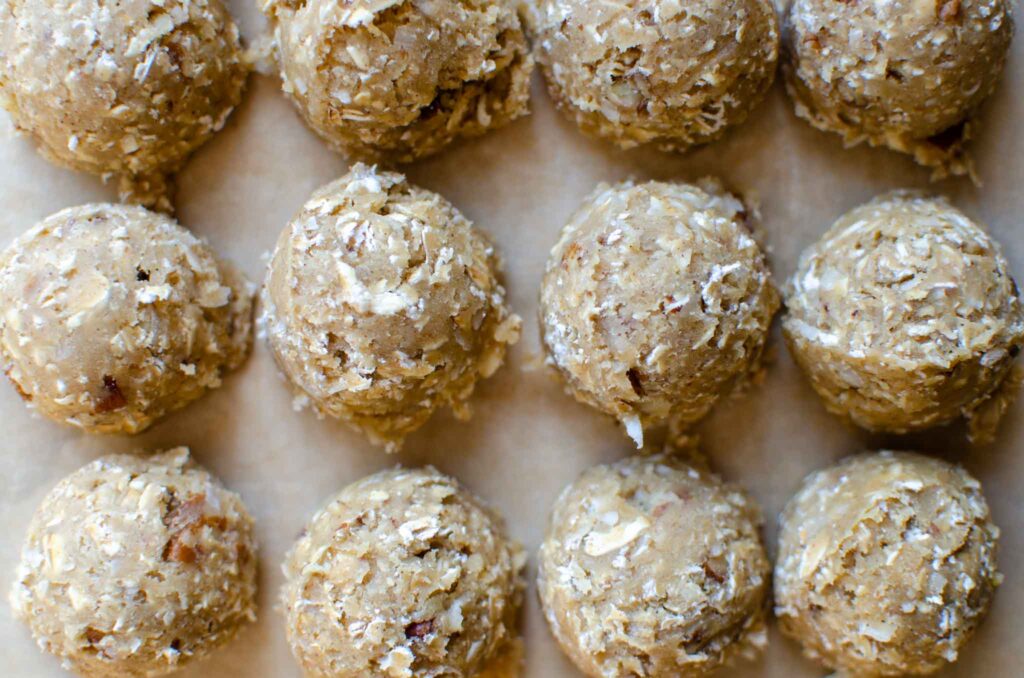 discard coconut pecan cookie dough balls close together on parchment paper