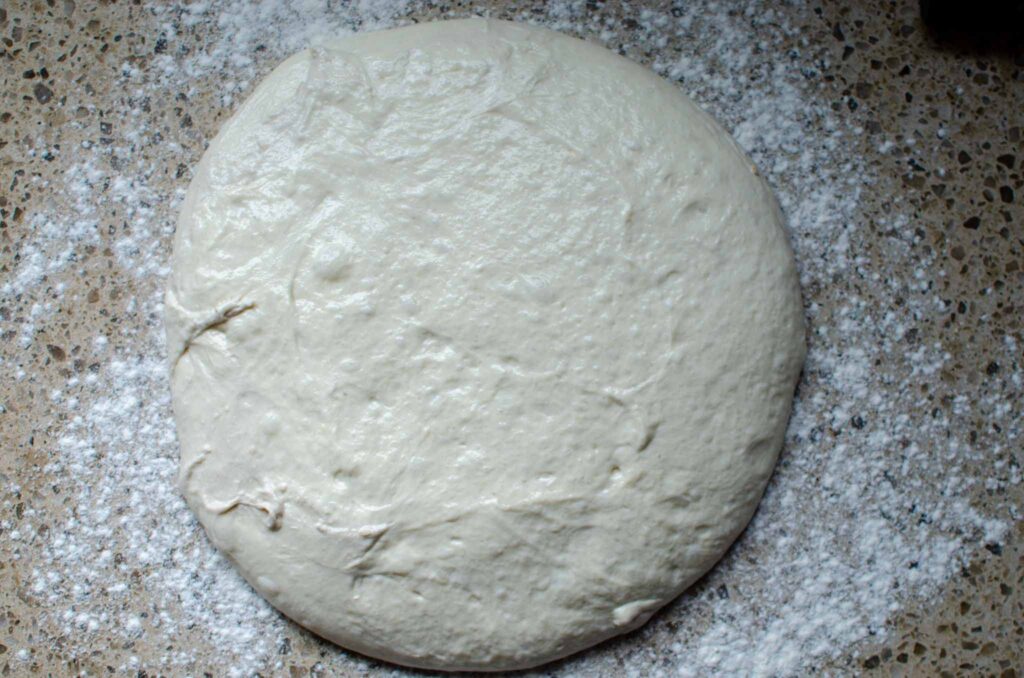 Sourdough ciabatta dough on a floured work surface