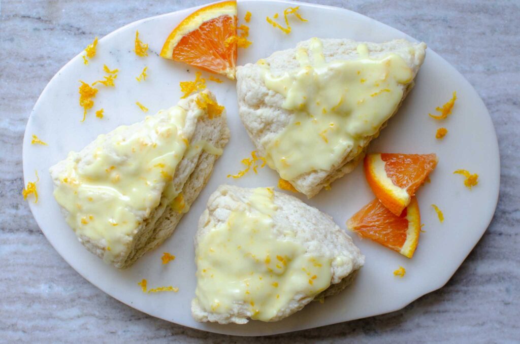 Easy Sourdough Discard Orange Scones with orange wedges