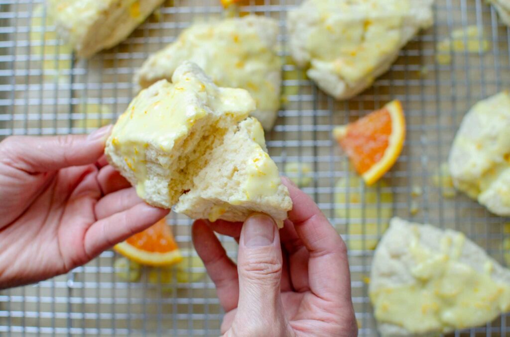 breaking an easy sourdough discard orange scone in half