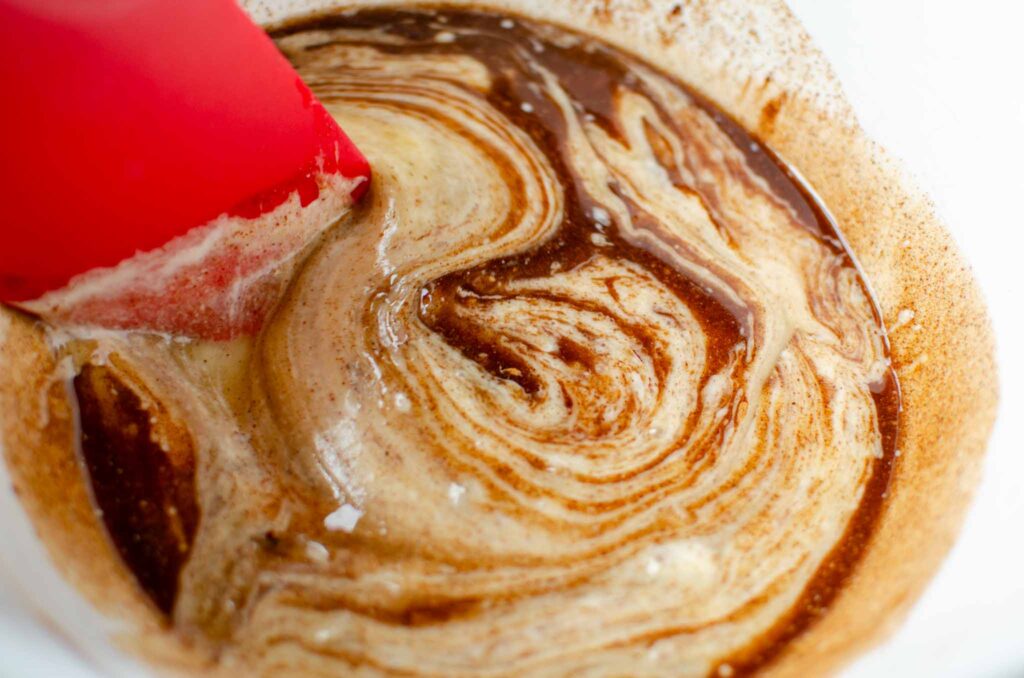 The wet ingredients combined in a large bowl to make sourdough granola