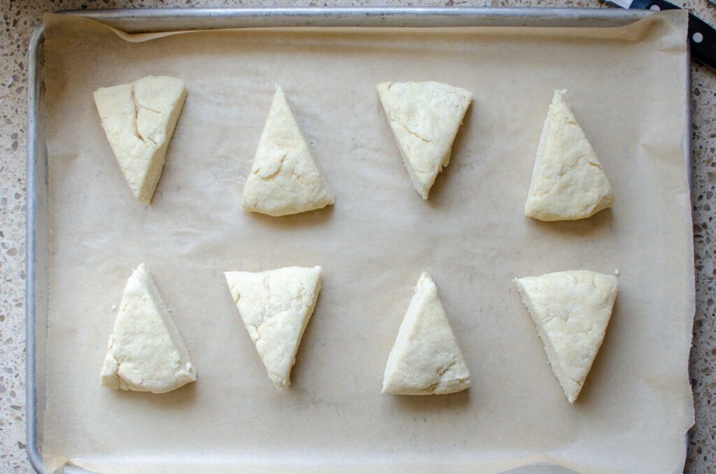 Easy Sourdough Discard Orange Scones dough wedges on parchment lined baking sheet