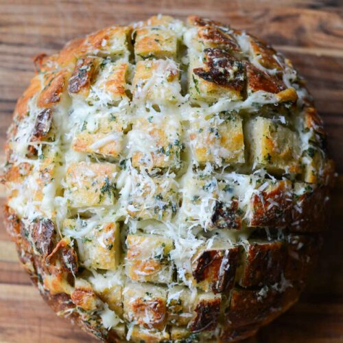 a loaf of easy sourdough cheese and garlic pull apart bread