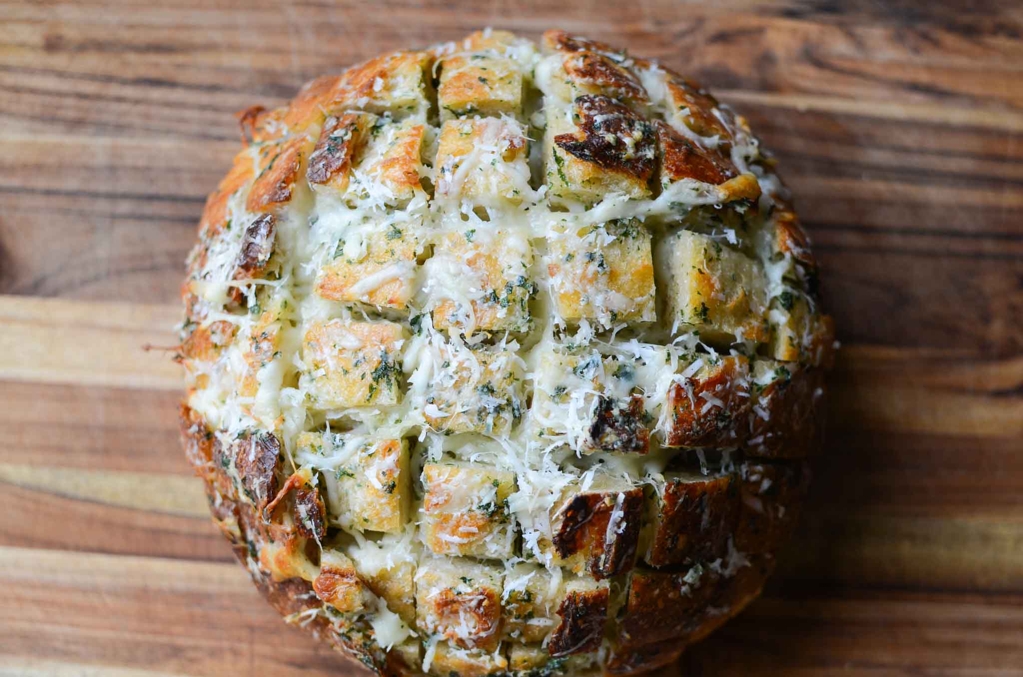 a loaf of easy sourdough cheese and garlic pull apart bread