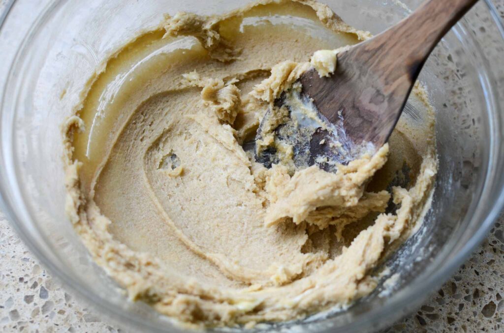 creaming butter and brown sugar for sourdough white chocolate cranberry oatmeal cookies