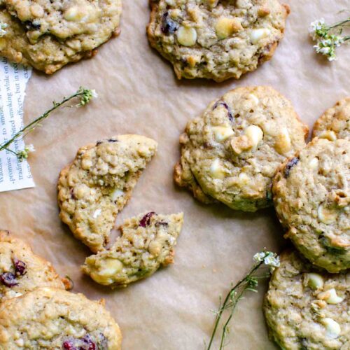 Sourdough White Chocolate Craisin Oatmeal Cookies on parchment paper