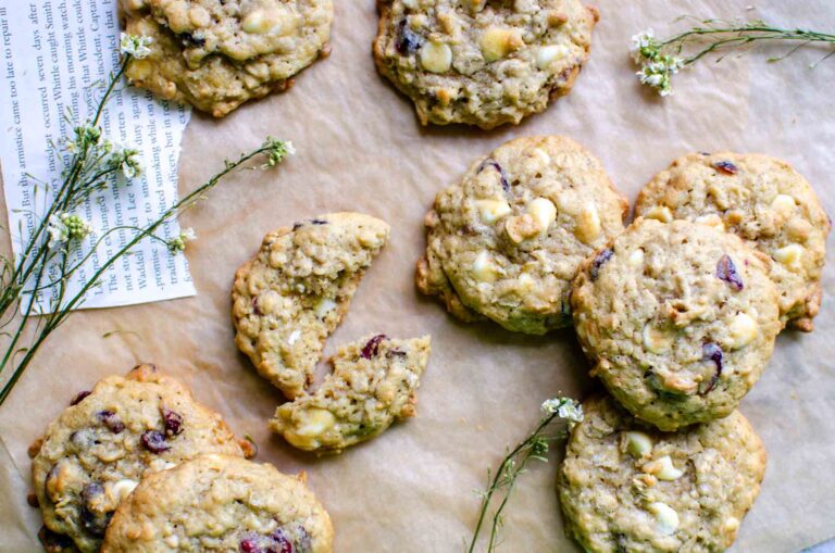 Sourdough White Chocolate Craisin Oatmeal Cookies on parchment paper