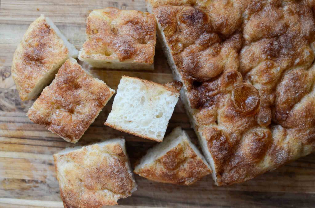 part of a loaf of sourdough cinnamon roll focaccia cut into pieces