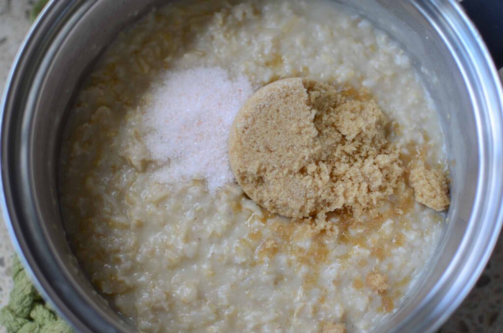 adding salt and brown sugar to cooked oatmeal for dinner rolls