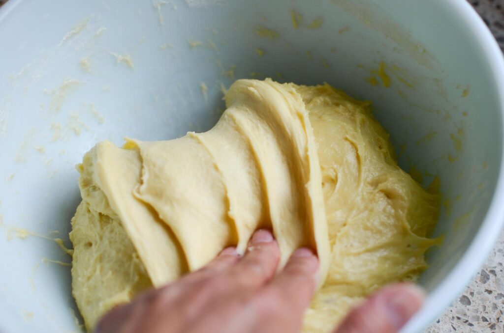 final fold for homemade sourdough cinnamon rolls dough