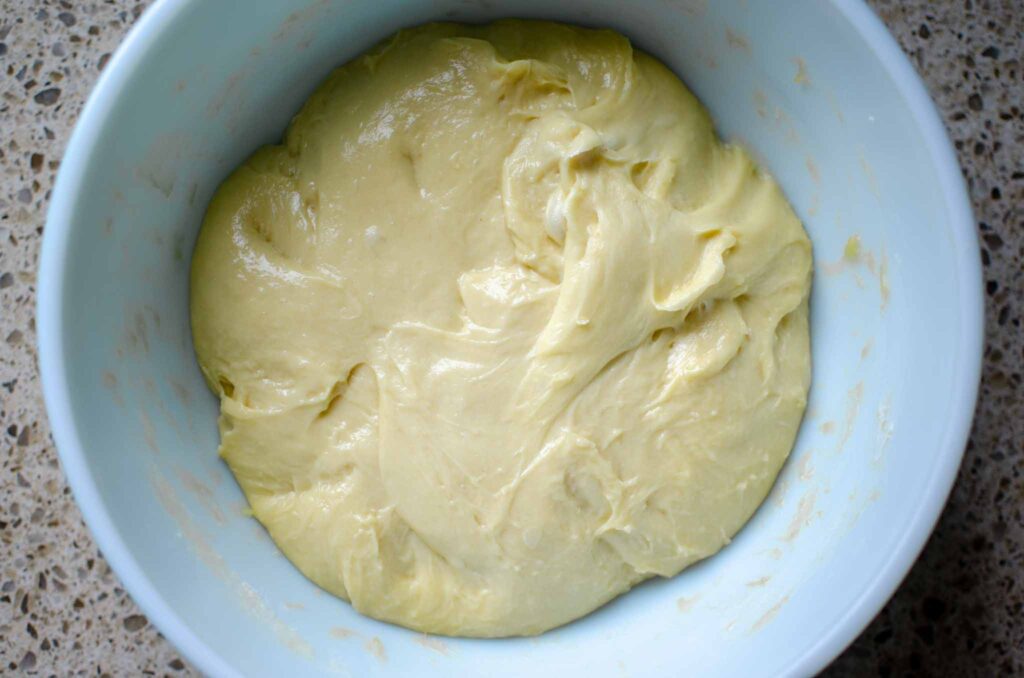 a bowl of sourdough cinnamon roll dough bulk fermenting