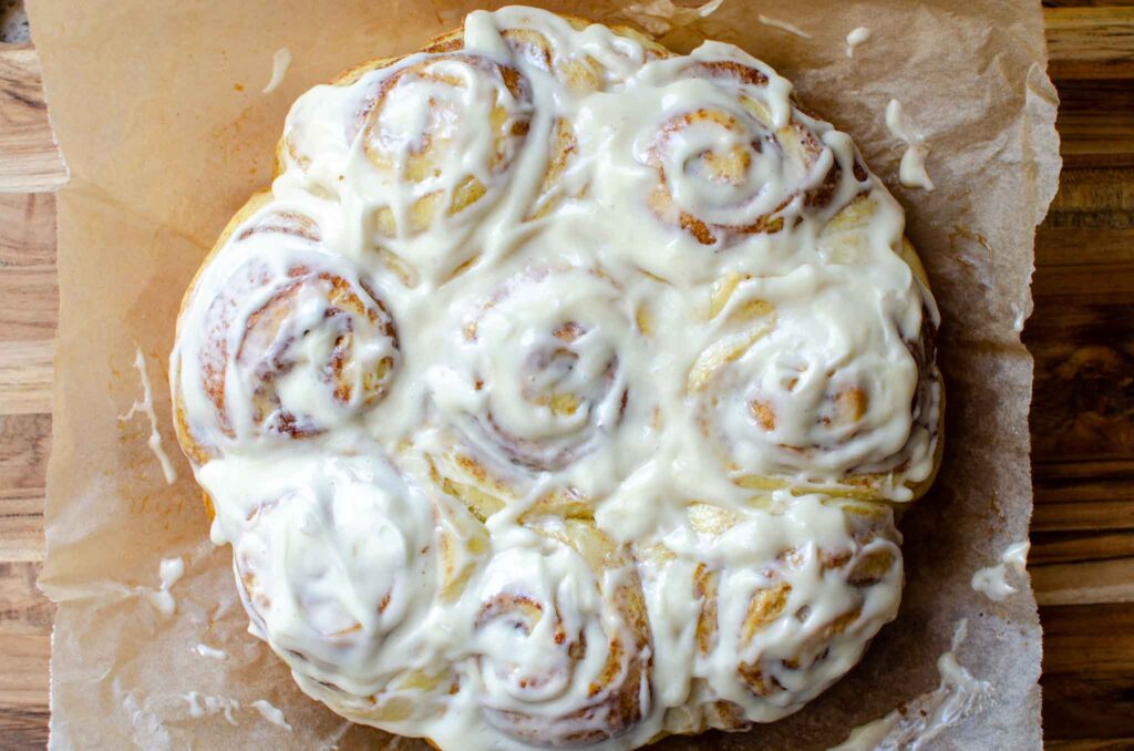 homemade sourdough cinnamon rolls frosted with cream cheese frosting