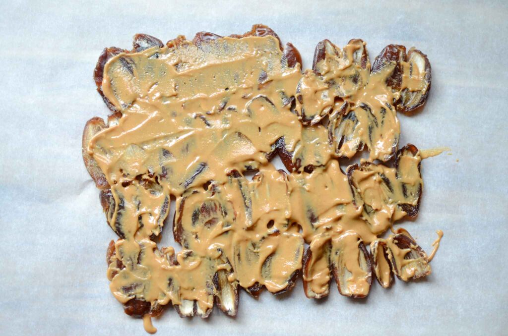 spread peanut butter over dates