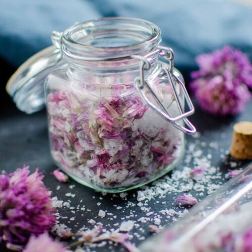 Chive blossom salt in glass container