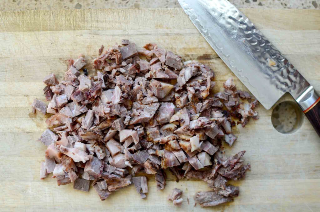 Chopped beef brisket on wood cutting board