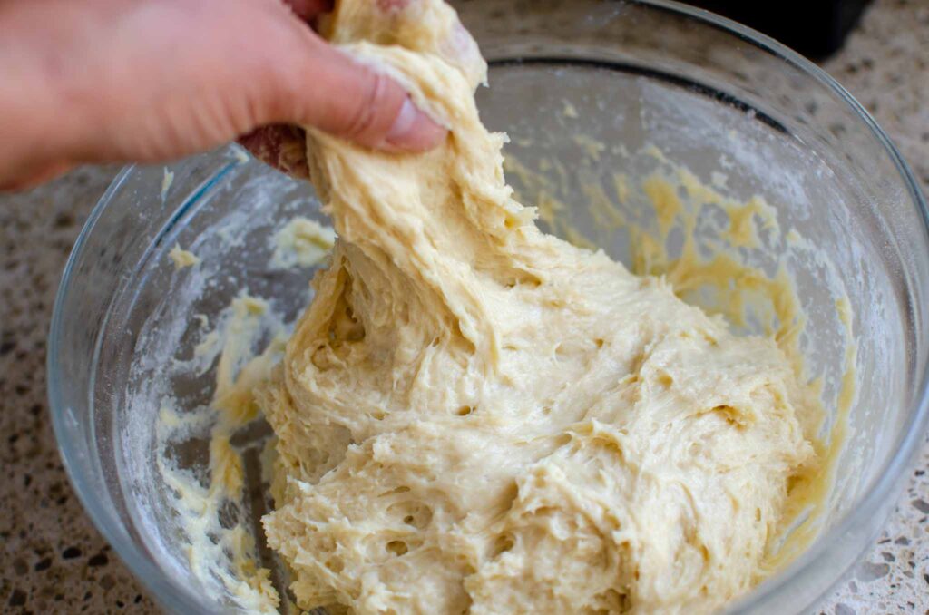 stretching hamburger bun dough