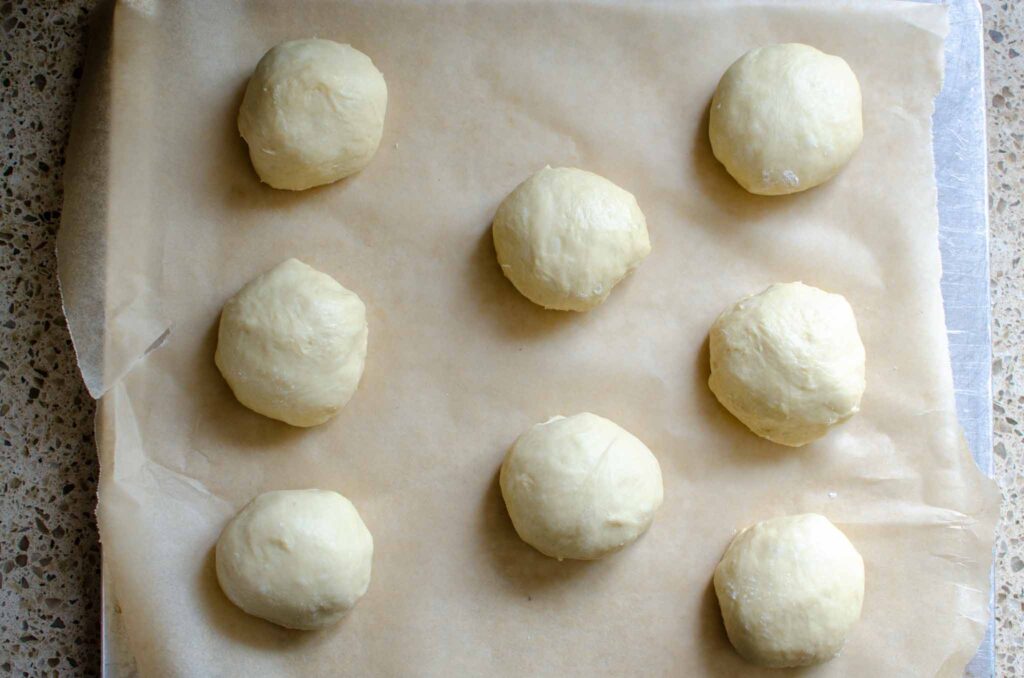 shaped dough balls on baking sheet