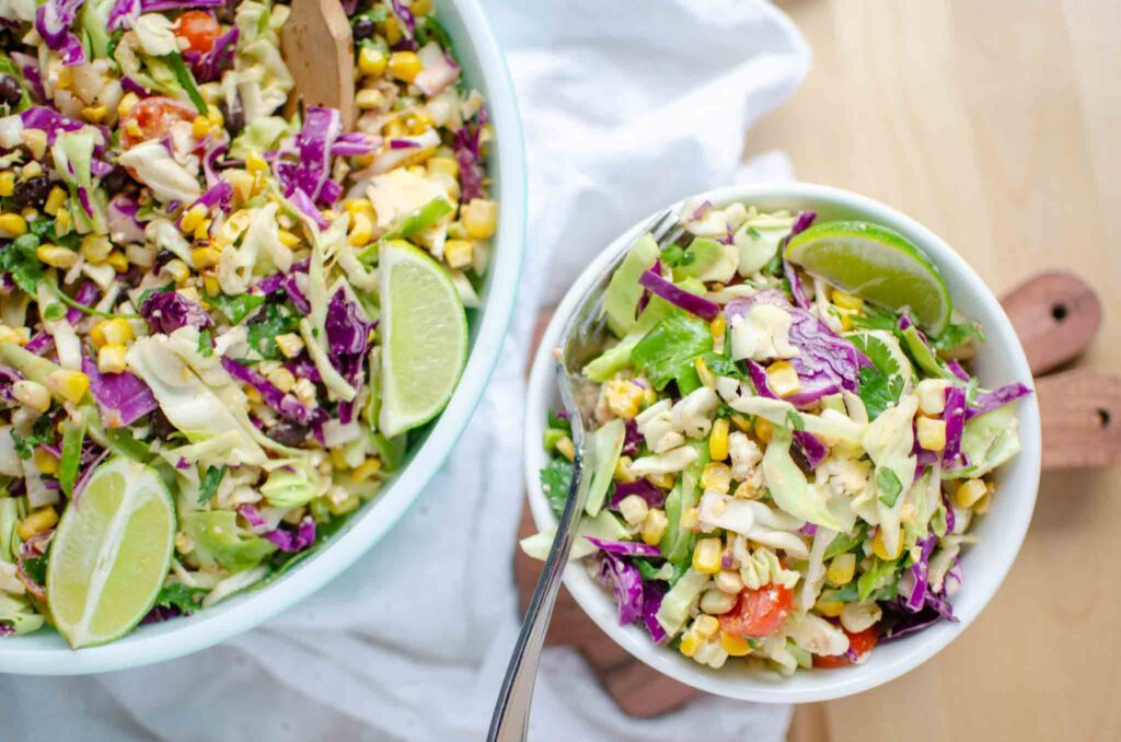 mexican street corn salad in small bowl and large bowl