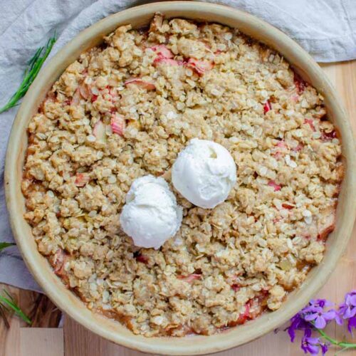 easy homemade rhubarb crisp with two scoops of vanilla ice cream