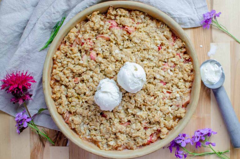 easy homemade rhubarb crisp with two scoops of vanilla ice cream