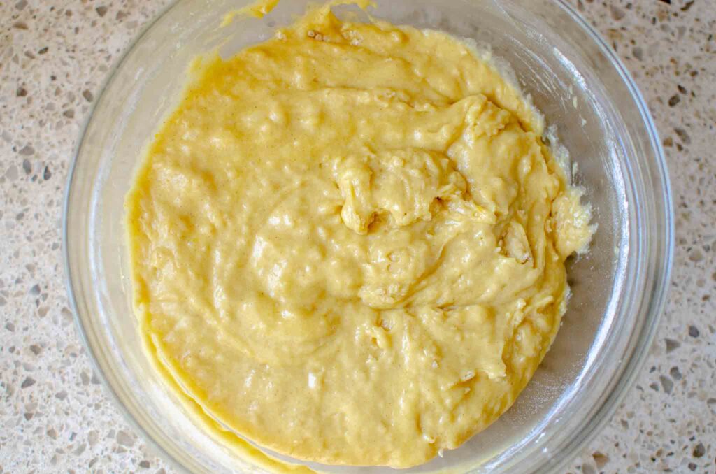 sourdough zucchini bread batter in glass bowl