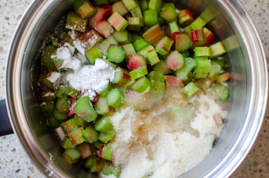 Rhubarb compote ingredients in a heavy bottom saucepan