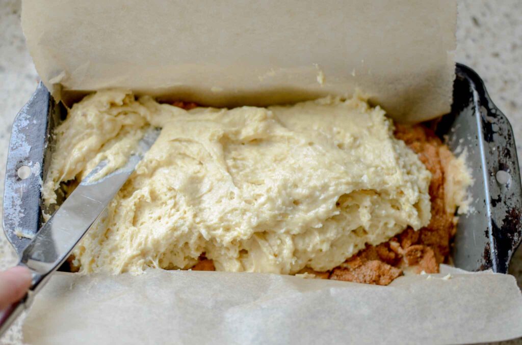 spreading sourdough cinnamon sugar quick bread batter into pan