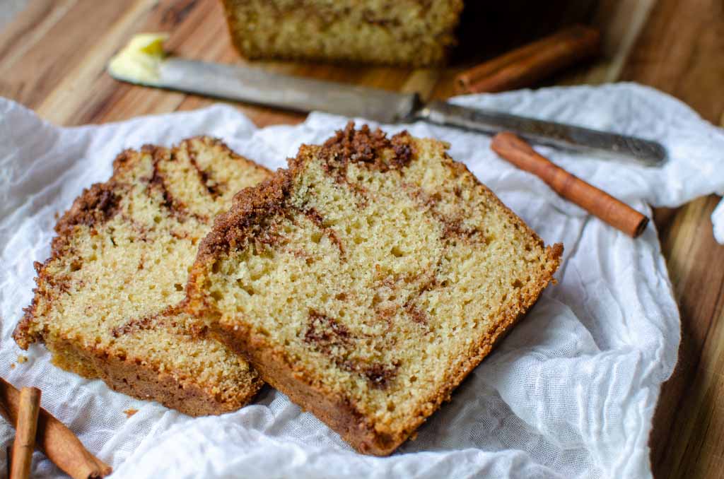 two slices of sourdough cinnamon sugar quick bread on white linen